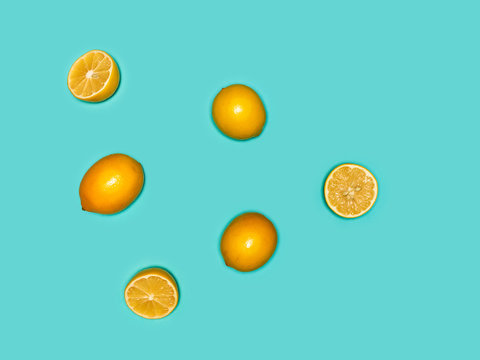 The fresh lemons on blue background
