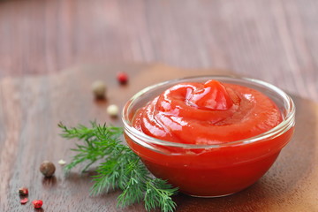 Tomato sauce ketchup with seasonings in a glass bowl