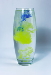 paint in the water. Watercolor paint in a vase