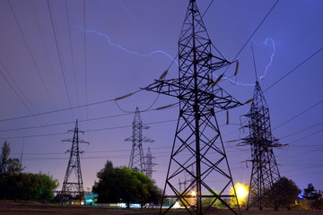 Power transmission lines being struck by lightning during the night thunderstorm
