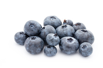 Close up of a blueberry branch isolated over white.