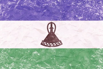 Vintage Lesotho flag texture  on crumpled sack paper