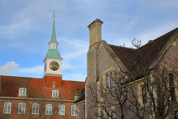 Fototapeta na wymiar WINCHESTER, UK: Exterior view of the Castle Hill along Castle Avenue and close to the Great Hall with a Clock Tower 