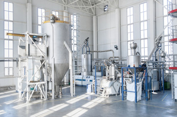 in the workshop machines for processing and manufacturing of plastic granules. a factory for...