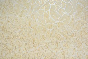 Closeup surface of wall with beige pattern