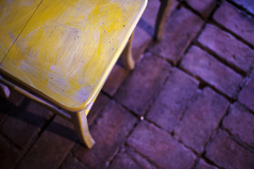 Wooden Chair on Brick Floor