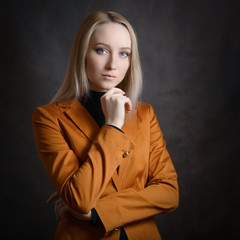 Business woman portrait on dark background.