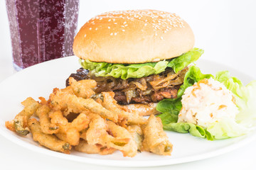 Grilled Chicken Burger with caramelized onions served with jalapeno fries and coleslaw