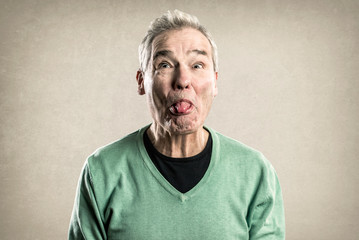 Portraits of a Senior Man - Expressions Series -  Funny Sticking out Tongue