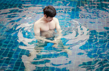Handsome Asian Man Enjoy In Swimming Pool