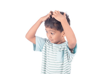 cute asian little boy scratching on head on white background
