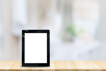 Mock up Blank screen Tablet wood table and blurred bath room background.