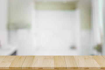 Empty top wood table and blurred bath room background.