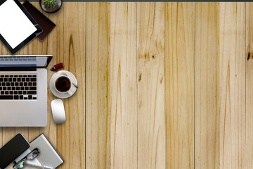 Fototapeta premium Hero Header Concept. Blank screen Tablet and Office Supplies with Workspace on wood table, Above view.