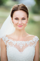 Fototapeta premium Portrait of stunning bride in lace dress