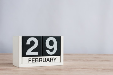 February 29th. Cube calendar for february 29 on wooden table with empty space For text. Leap year, intercalary day