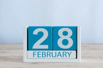 February 28th. Cube calendar for february 28 on wooden desk with empty space For text. Not Leap year or intercalary day
