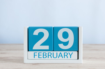 February 29th. Cube calendar for february 29 on wooden workplace with empty space For text. Leap year, intercalary day