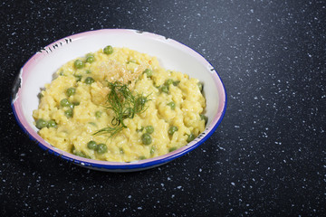 risotto with beans and saffron on white plate