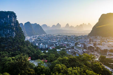 Yangshuo sunset cityscape skyline with Karst mountains in Guangxi Province, China