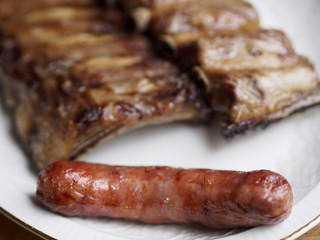 Creole sausage with unfocused roasted sliced barbecue ribs pork