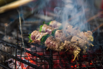 Enoki Mushrooms, wrapped with pork bacon fried on coals barbecue food