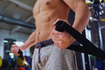 Concept gym exercise sport. Hand man shakes muscles.