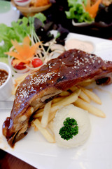 beef steak dish on wood background