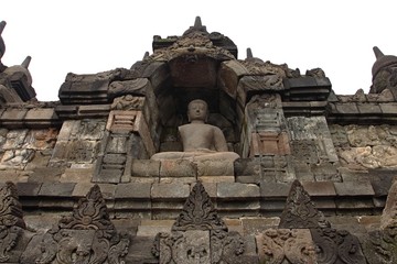 Buddha statue in stupa, Borobudur, near Yogyakarta/Borobudur temple stupas near Yogyakarta, Java, Indonesia/