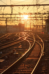 Naklejka na ściany i meble Sunrise over the empty railroad tracks at Perrache station in Lyon, France.