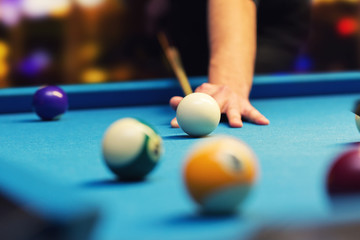 bar billiard - hand aiming the cue ball