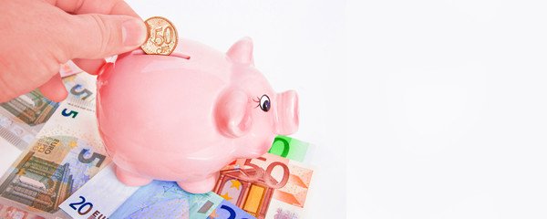 Sparschwein und 50 Cent Euro Münze