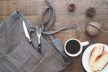 Sliced homemade bread with coffee on wood table with copy space