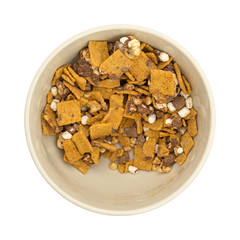 Top view of a bowl of partially eaten smores candy mixture isolated on a white background.