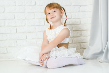 pretty little girl in a beautiful white dress