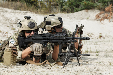 Members of US Army Rangers machinegun crew during the fight in the desert