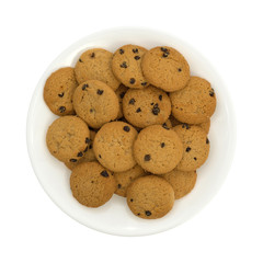 Top view of vanilla chocolate chip crunchy cookies on a plate isolated on a white background.