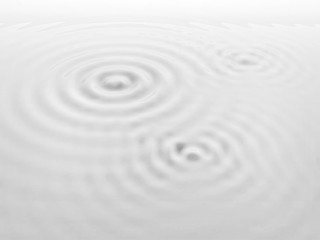 Fototapeta premium Ripples on a white liquid surface.