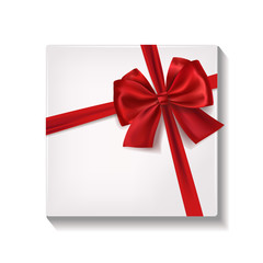 Realistic white gift box with red satin ribbon and bow.