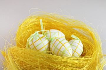Easter eggs in the yellow nest 