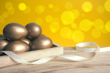 gold eggs with wood box