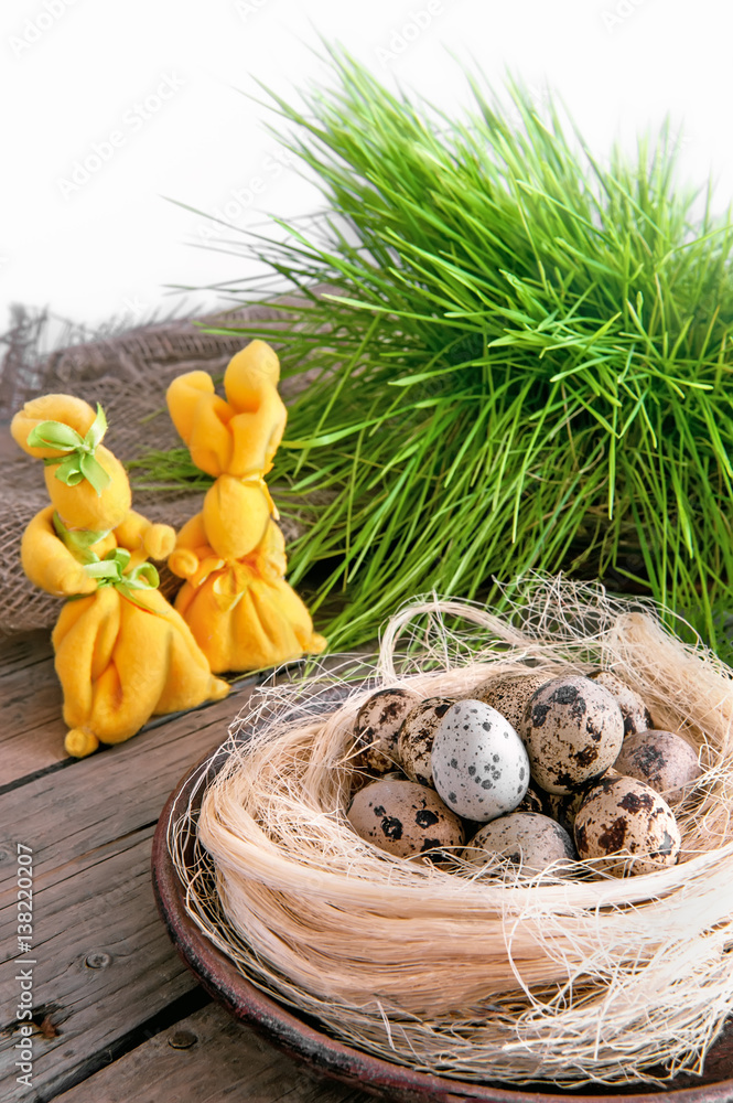 Wall mural two yellow easter bunny with nest and eggs quail