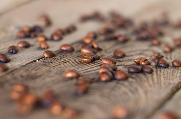 Coffee beans on the wooden table in sunset rays