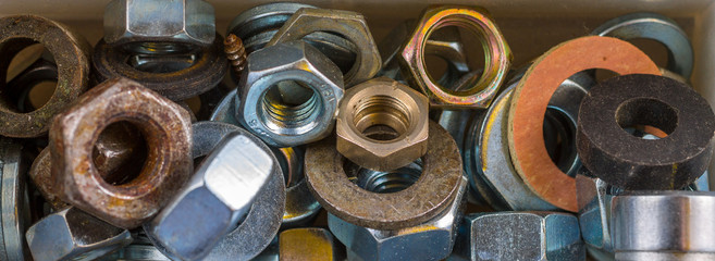 Old nuts and washers. Industrial bachground