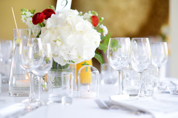 Beautiful table setting with crockery and flowers for a party, wedding reception or other festive event