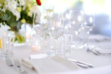 Beautiful table setting with crockery and flowers for a party, wedding reception or other festive...