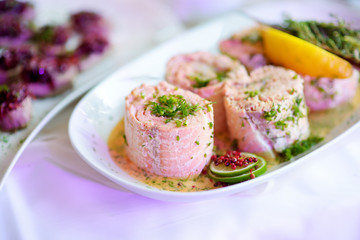 Delicious fish rolls with vegetables served on a party or wedding reception