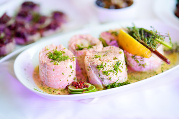 Delicious fish rolls with vegetables served on a party or wedding reception