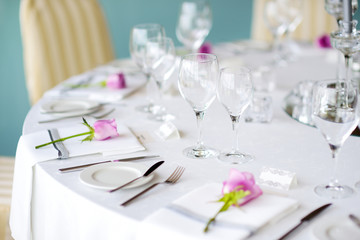 Beautiful table setting with crockery and flowers for a party, wedding reception or other festive event