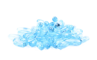 Pile of blue softgel pills isolated
